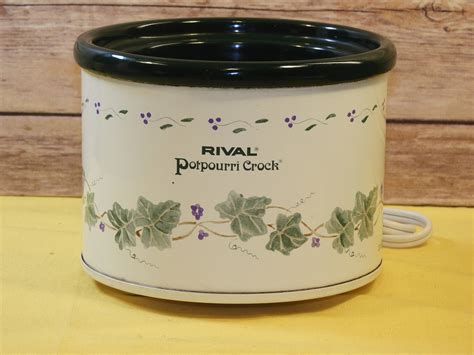 The removable round stoneware and glass lid are both dishwasher safe. . Rival potpourri crock
